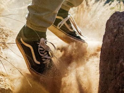 Blurred motion shot of a person's feet during a dynamic warm-up exercise.